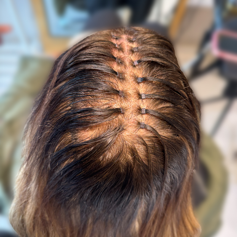 hair extension application on client