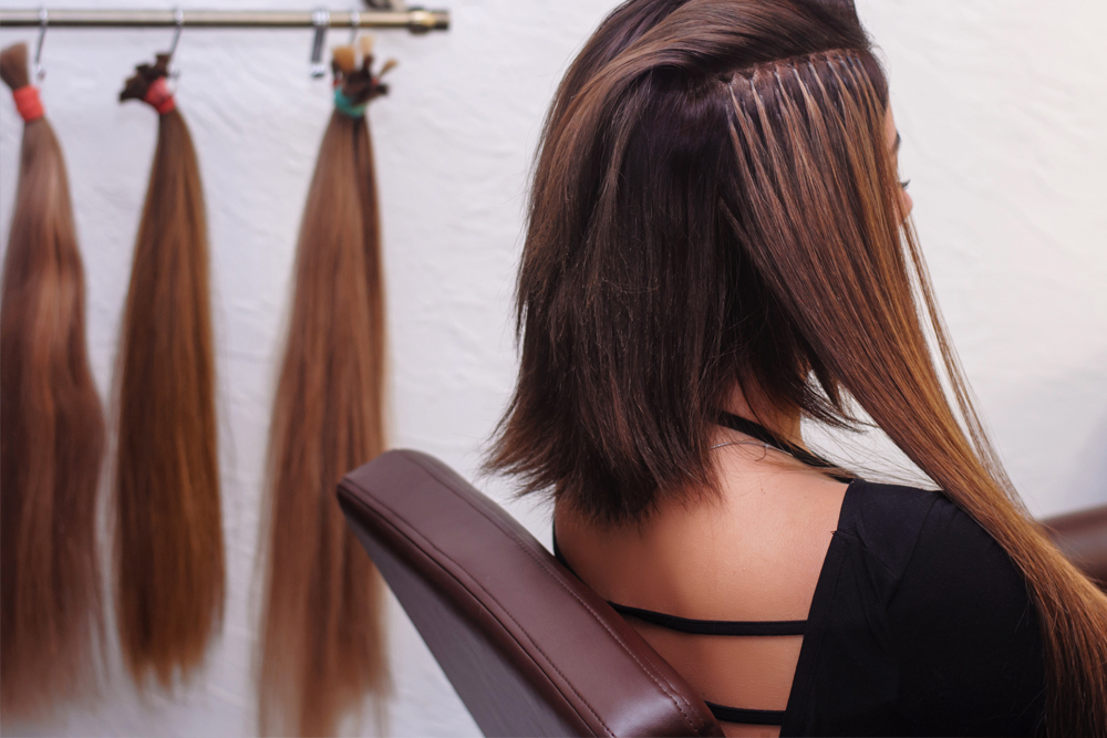 woman getting hair extensions